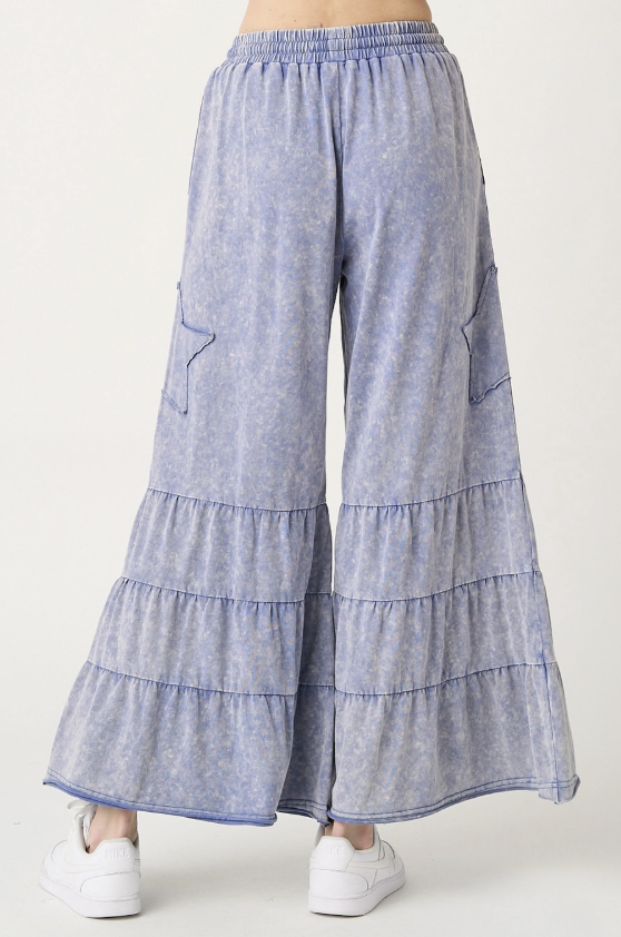 Light blue tiered pants on a white background