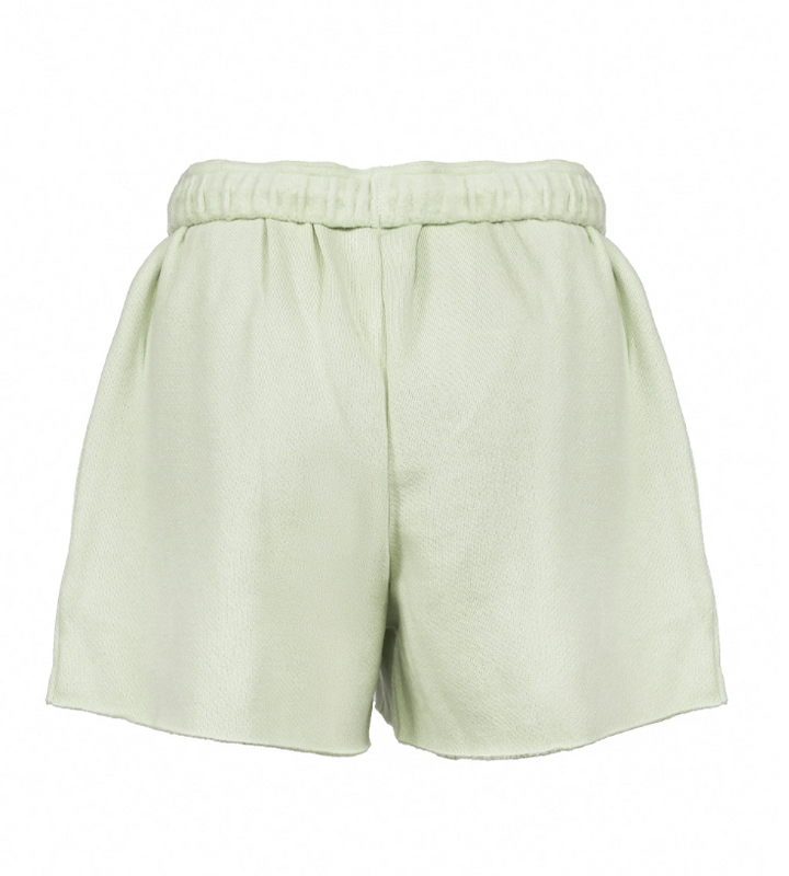 Light sage green shorts with an elastic waistband, shown from the back on a plain white background.