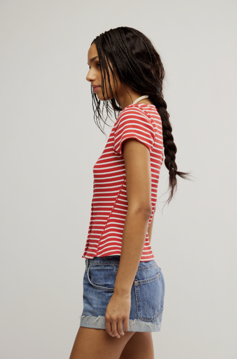 woman wearing red and white stripe shirt and blue jeans on white background