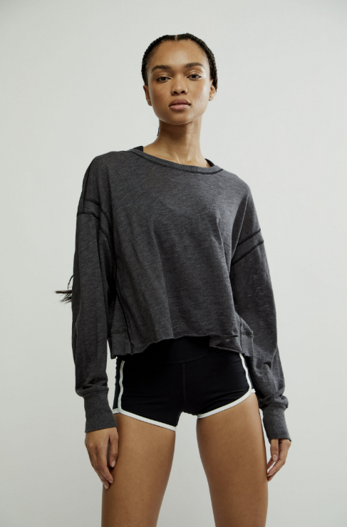 woman wearing black long sleeve on white background