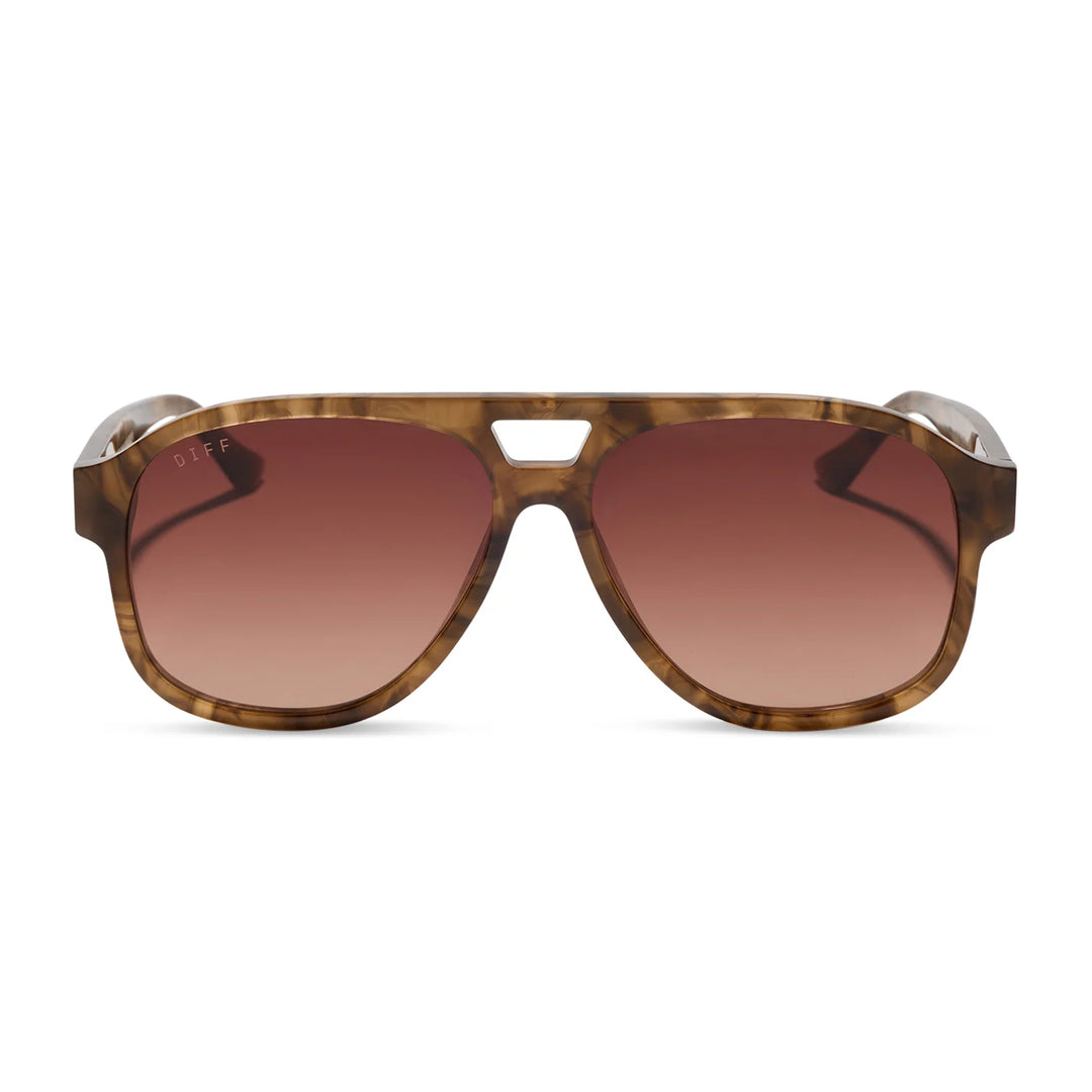 Sunglasses with brown gradient lenses and tortoiseshell frame on a white background