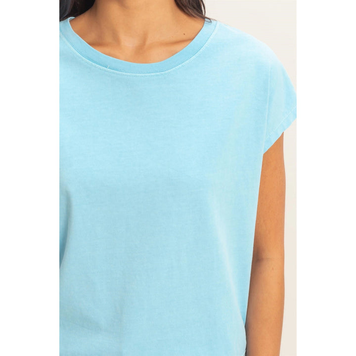Light blue t-shirt worn by a person on a white background