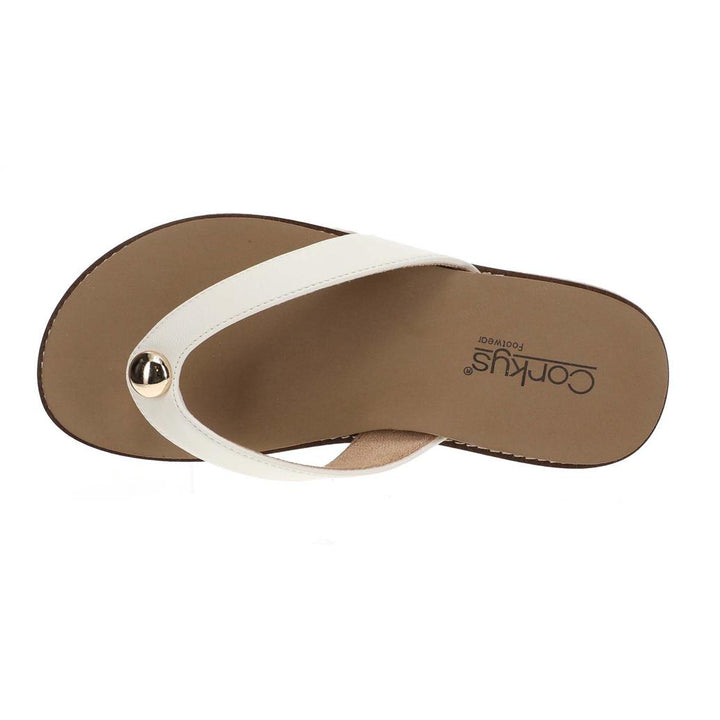 Brown sandal with a white strap on a light background