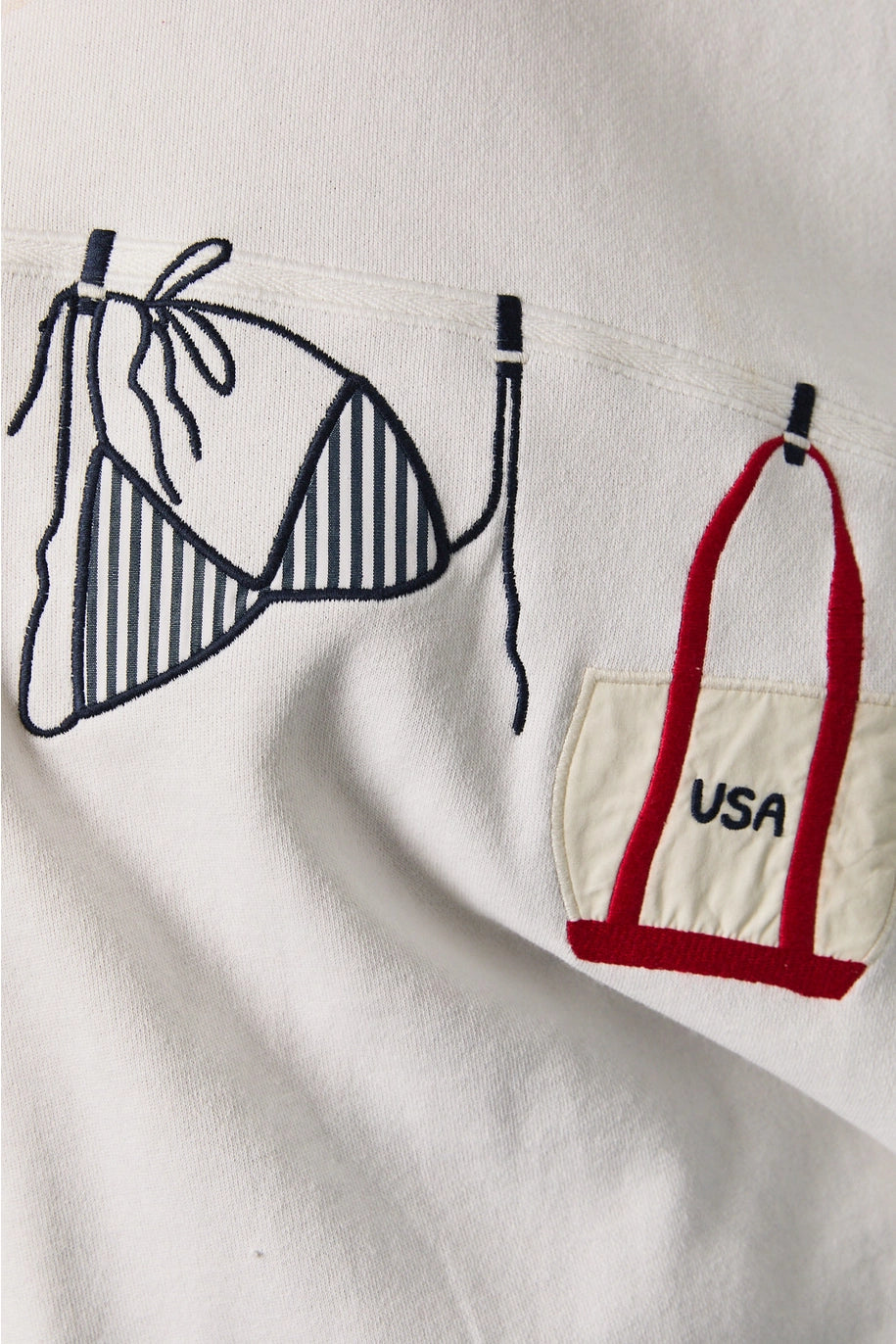 Close up of embroidery detail bathing suit graphic