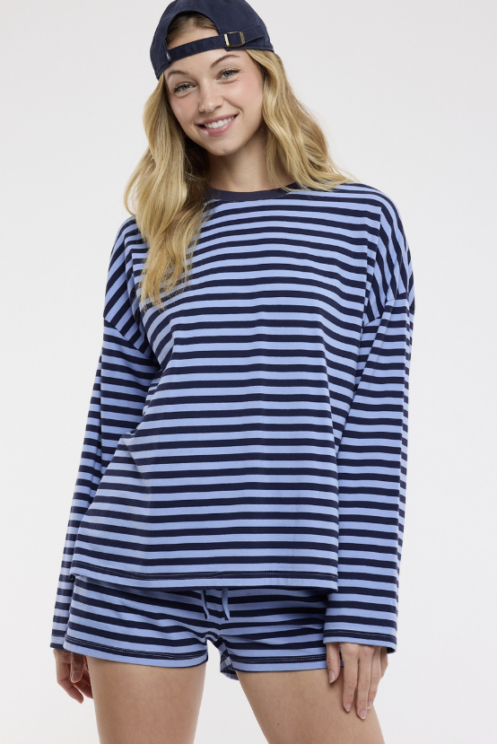 Woman wearing matching blue stripe set on white background