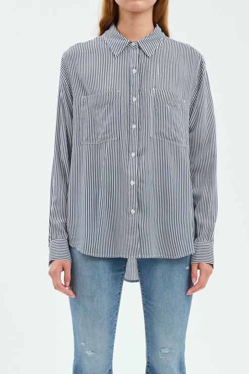 Person wearing a striped shirt and jeans on a white background