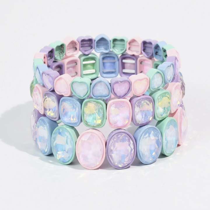 Pastel trio of bracelets stacked on white background