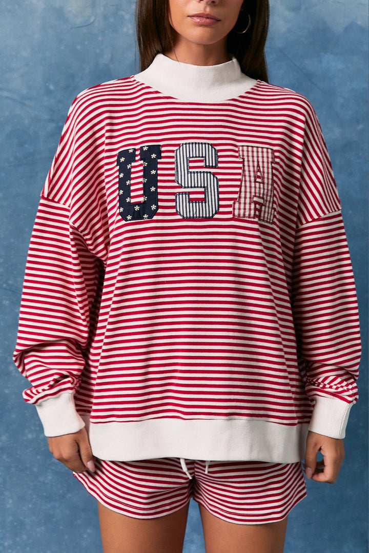 Woman wearing matching red and white stripe top and shorts on blue background