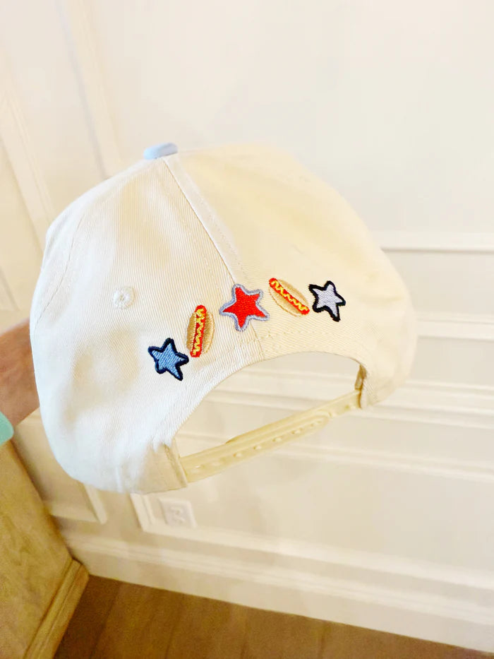 White cap with colorful embroidered stars on a white background