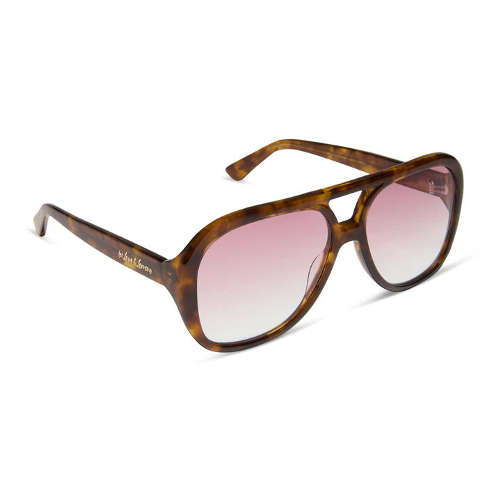 Tortoise sunglasses with rose gradient lenses on white background