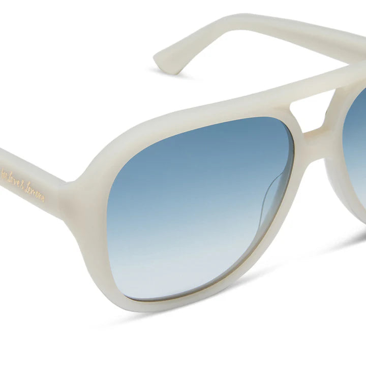 Beige sunglasses with blue gradient lenses on a white background