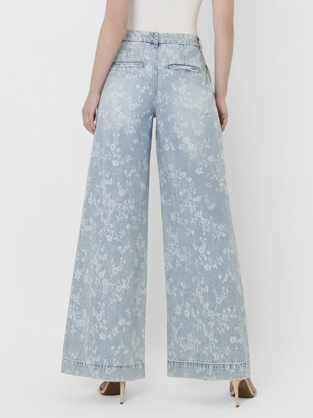 Light blue floral-patterned wide-leg jeans on a white background