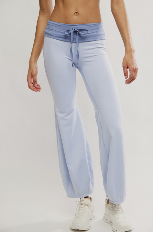Light blue pants with a tie waist worn by a person on a white background