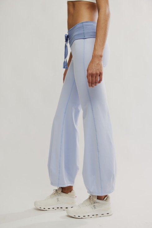 Light blue pants with a tie detail worn by a person on a white background