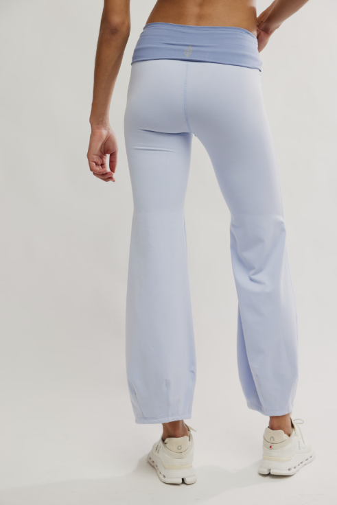 Light blue jogger pants worn by a person on a white background