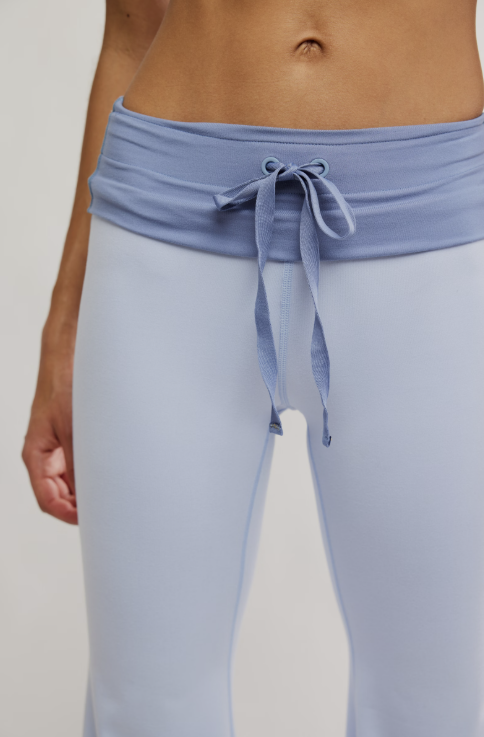 Light blue pants with a tied waistband on a plain background