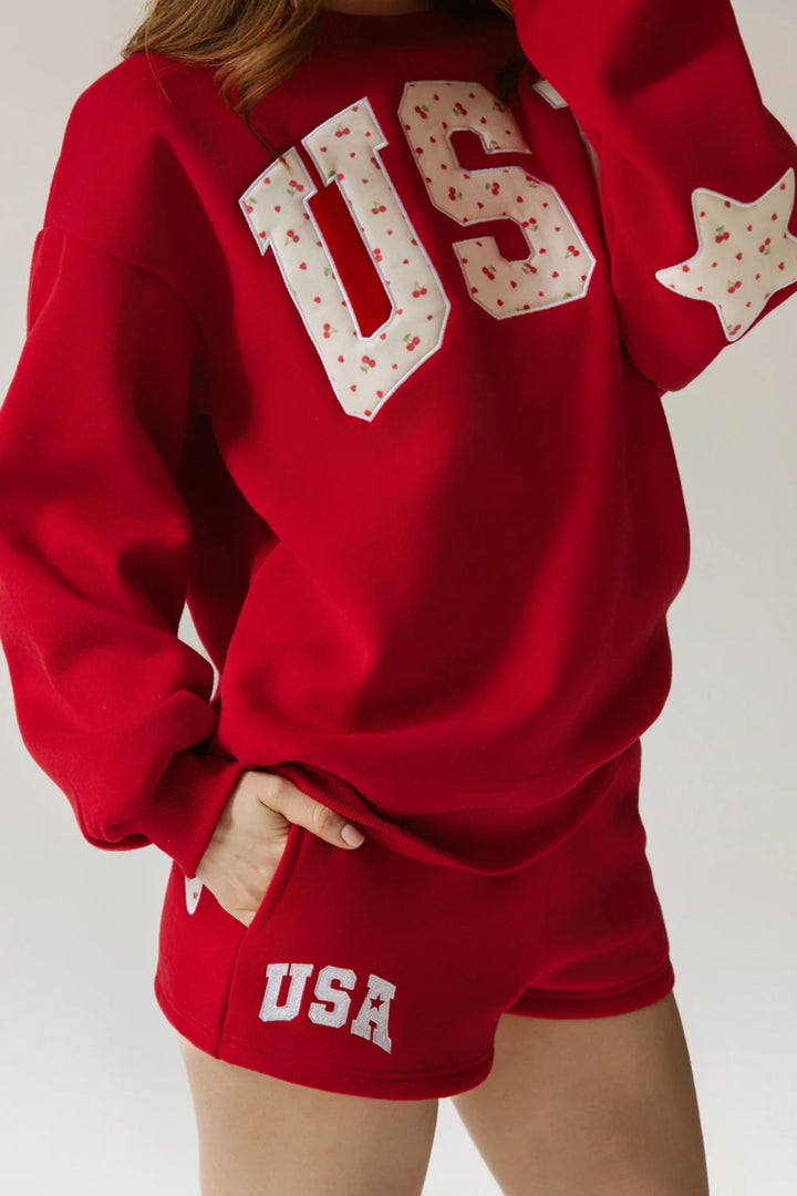 Red sweatshirt and shorts with &