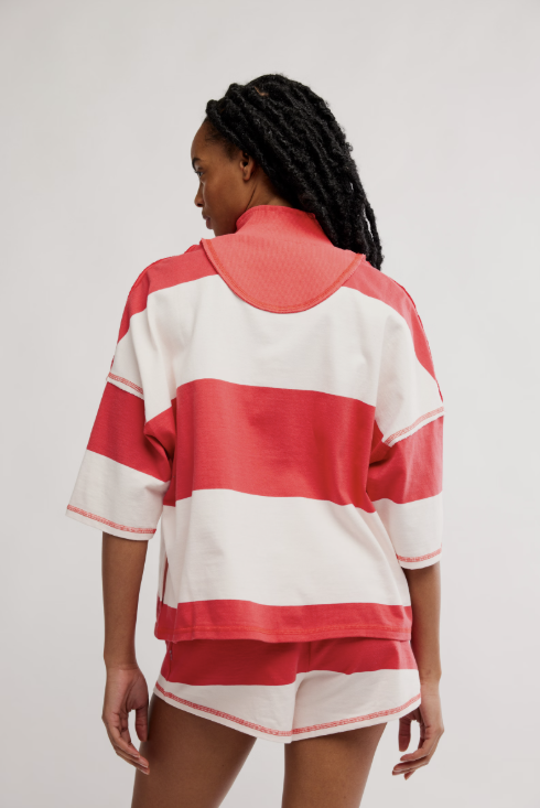 Woman wearing matching red and white stripe set on white background