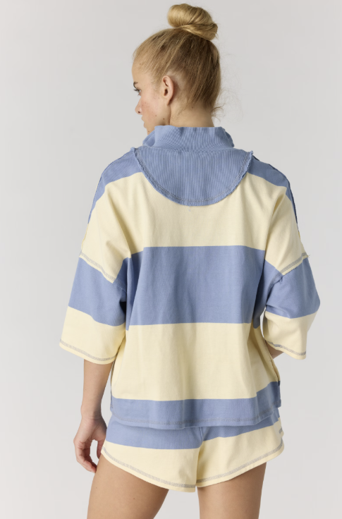 back of woman wearing matching stripe set on white background