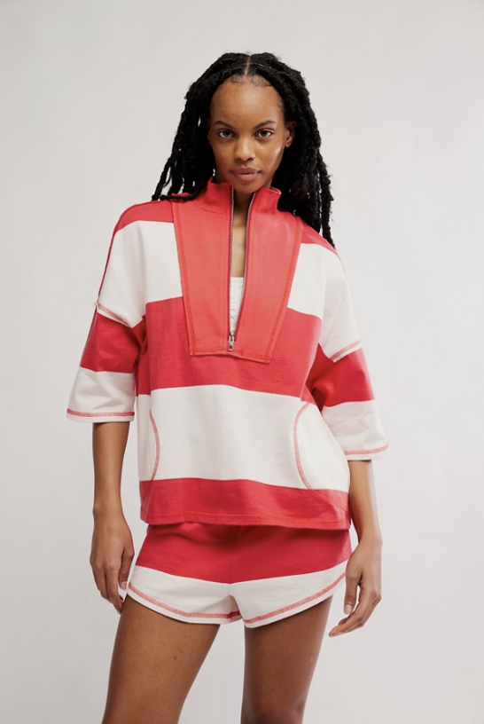Woman wearing matching red and white stripe set on white background
