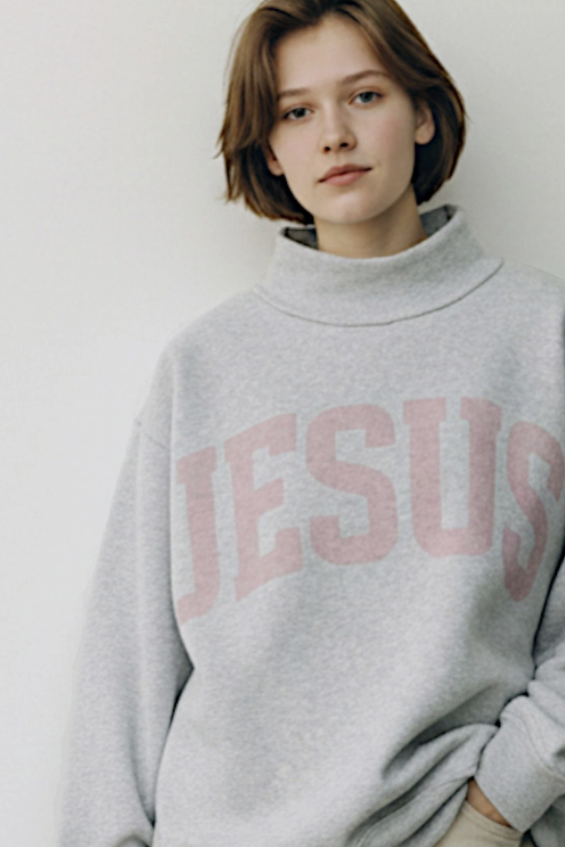 Woman wearing grey sweatshirt with &