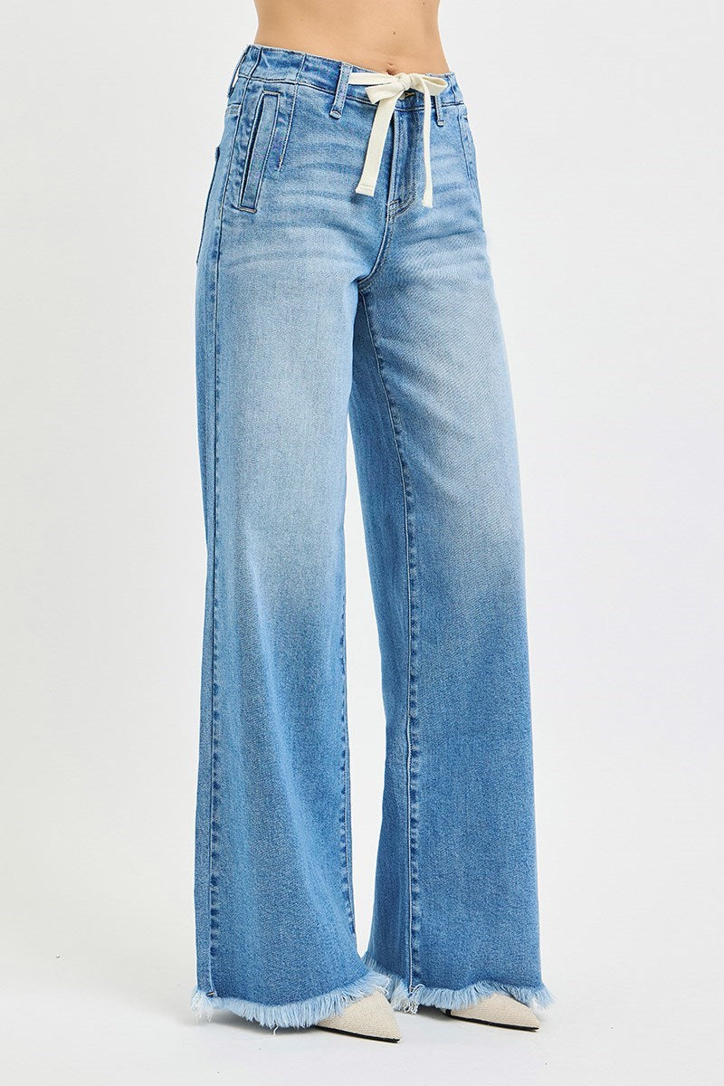 Light blue wide-leg jeans with a drawstring waist on a white background