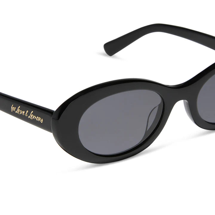 Black sunglasses with gold logo on a white background