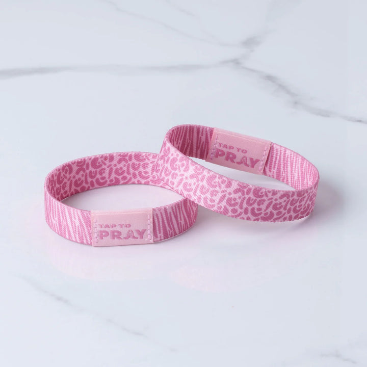 Two pink wristbands with &