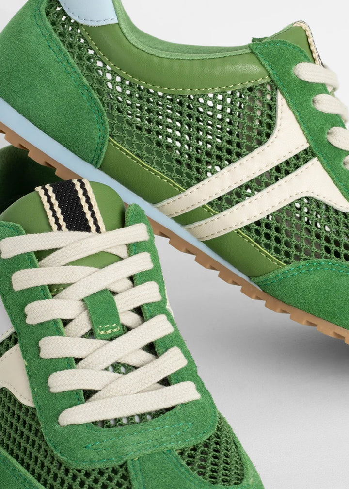 green sneakers on white background