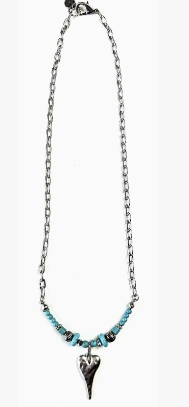 Silver and turquoise beaded necklace with heart pendant on white background