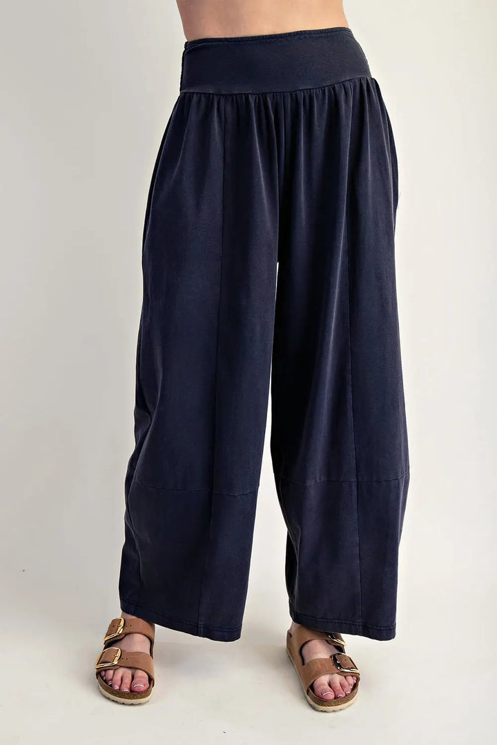 Navy blue wide-leg pants worn by a person on a plain background