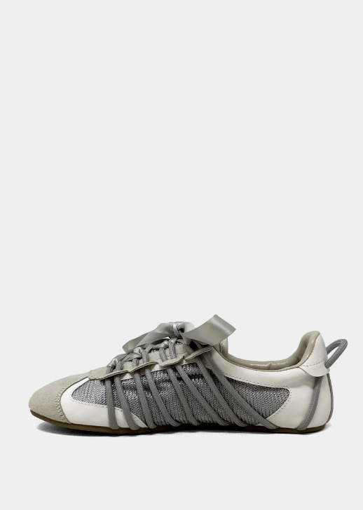 Gray and white sneaker on a light gray background