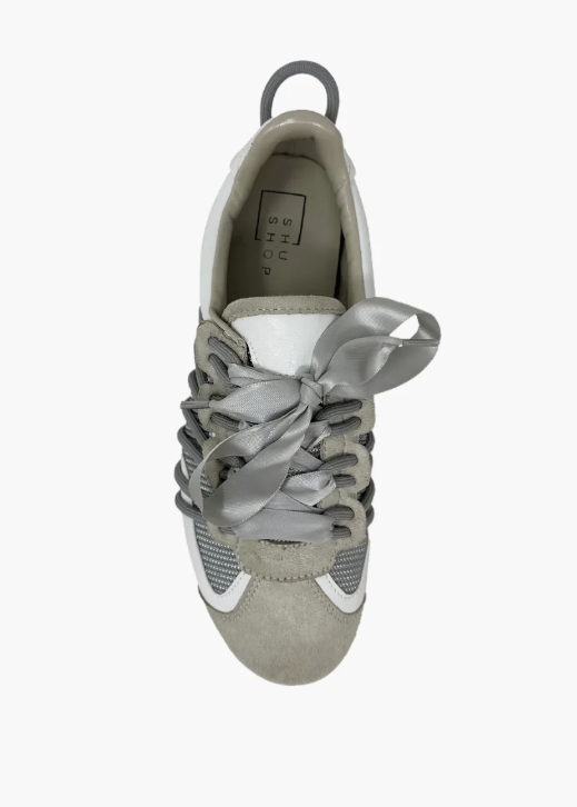 Gray sneaker with a bow on a white background