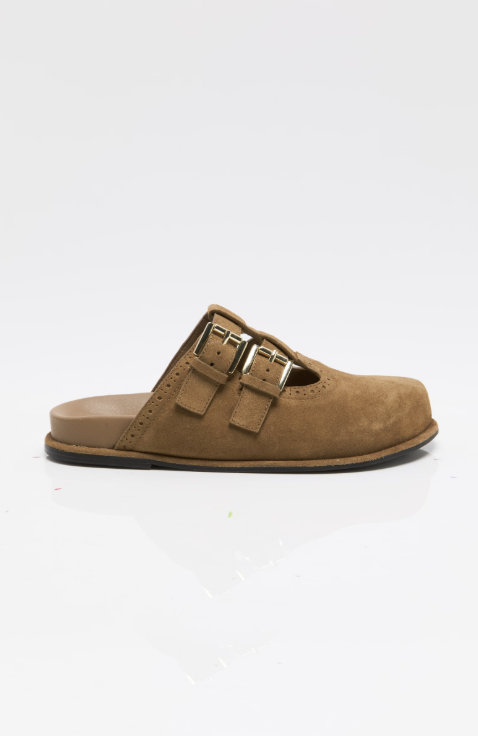 A single tan suede mule sandal with two adjustable double-buckle straps, shown in profile against a clean white background.