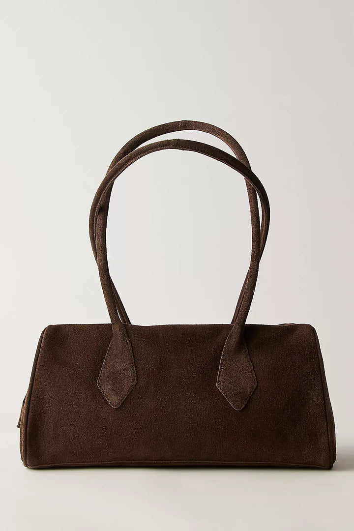 Brown handbag with a strap on a light gray background
