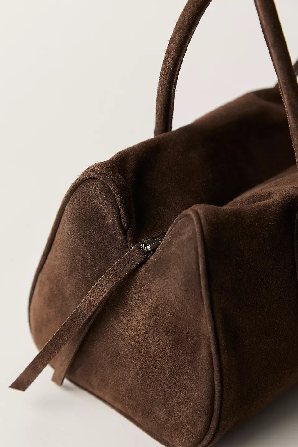 Brown Suede Purse on plain background