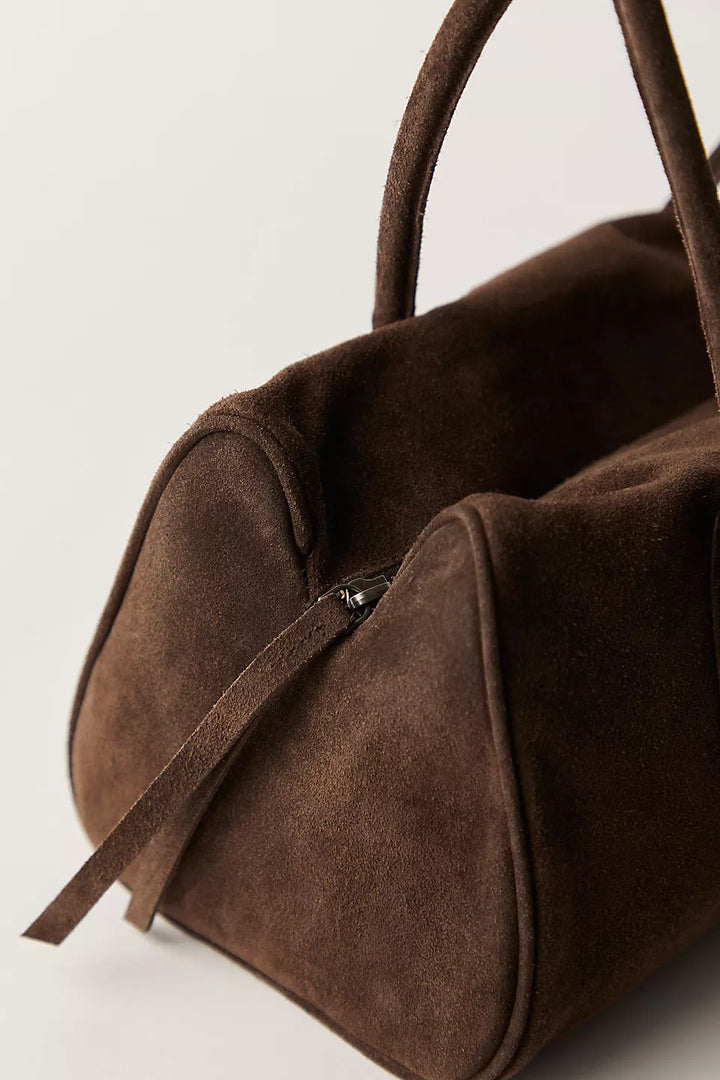 Brown Suede Purse on plain background