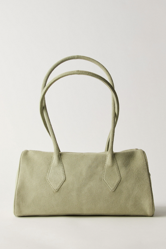 Green handbag on a light gray background