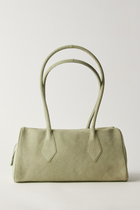 Green handbag with a plain background