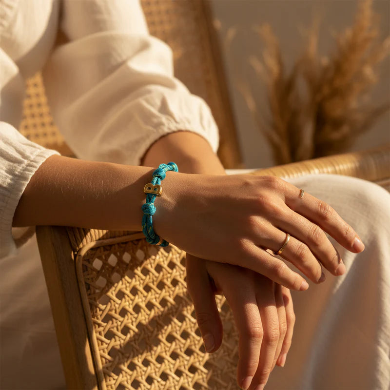 Woman wearing initial bracelet
