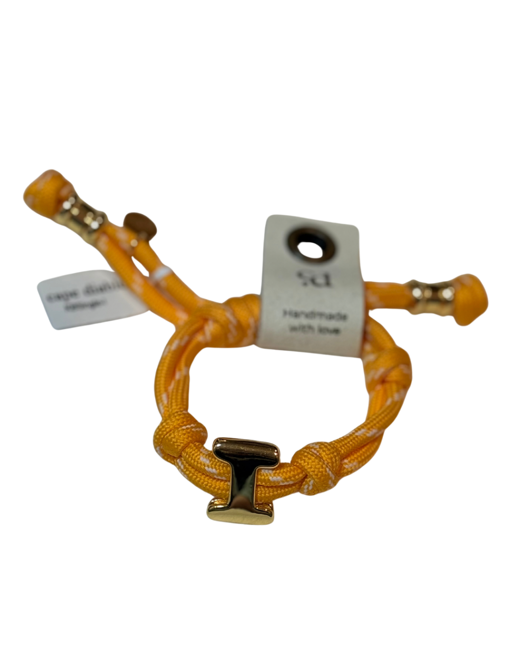 Yellow braided bracelet with a gold clasp on a white background