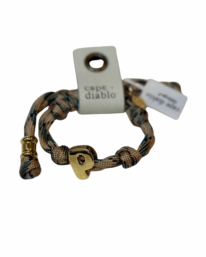 Bracelet with heart lock charm and 'cape diablo' tag on a white background