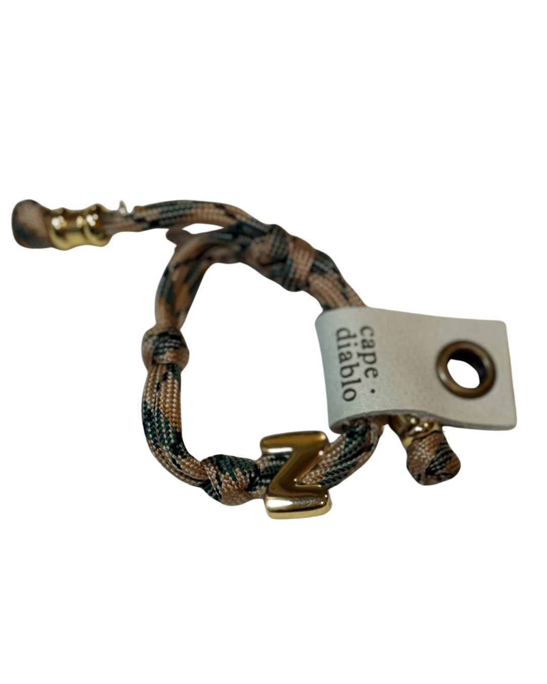 Bracelet with braided design and gold accents, featuring a visible brand tag on a white background.
