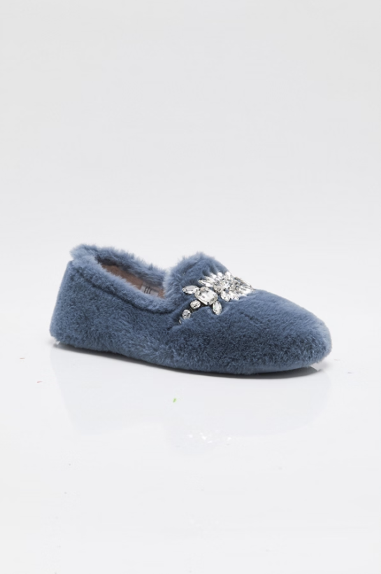 A single blue fuzzy slipper with a silver rhinestone snowflake embellishment on the toe, shown on a white reflective surface against a white background.