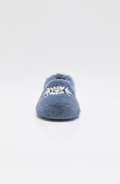 A single blue fuzzy slipper with a silver rhinestone embellishment across the top, photographed against a seamless white background.