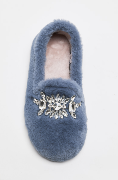 A single fuzzy slipper in dusty blue with a silver rhinestone floral embellishment on the vamp, shown from a top-down view on a white background.