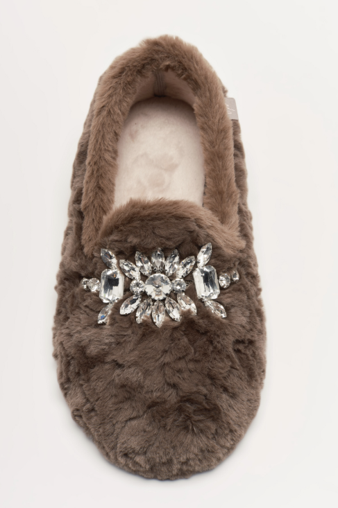 A single brown faux fur slipper with a large silver crystal flower embellishment on the toe strap, shown against a plain white background.
