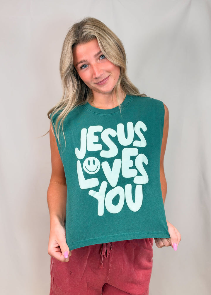 Woman wearing teal muscle tee with &