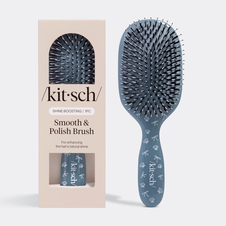 Blue hairbrush with packaging labeled &
