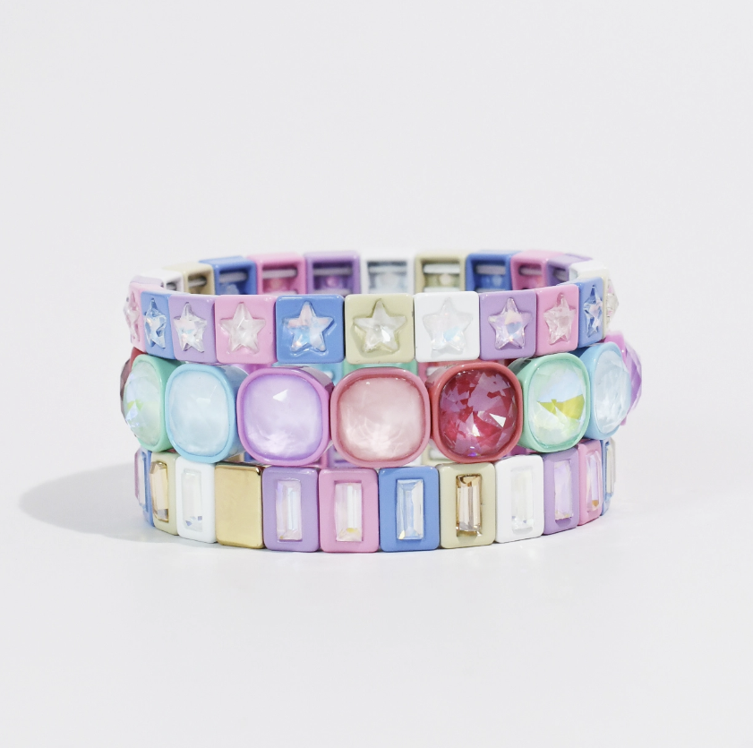 Pastel bracelet stack including three bracelets on white background